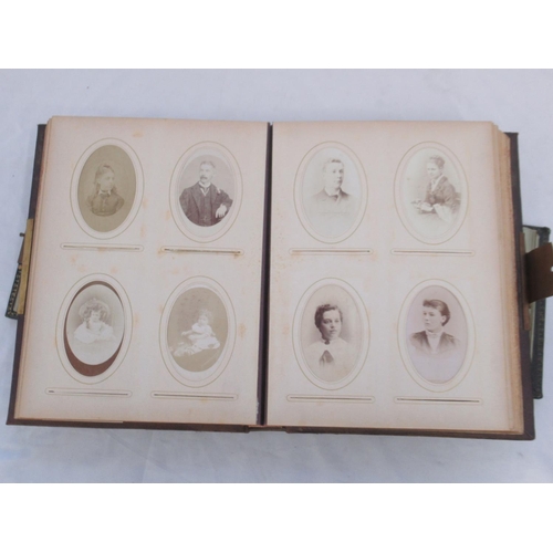  Three Victorian photograph albums containing period carte de visite portraits and cabinet cards