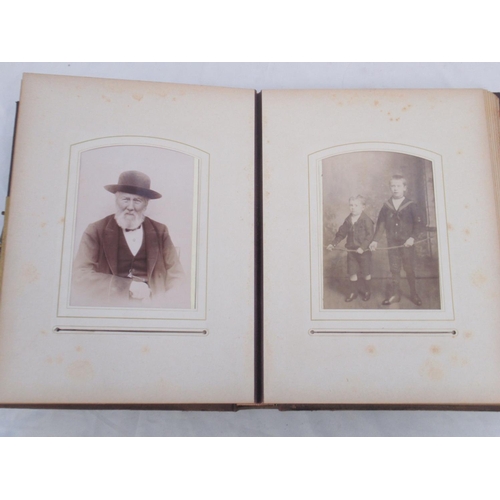  Three Victorian photograph albums containing period carte de visite portraits and cabinet cards