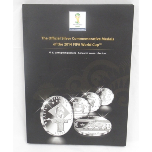 102A - 'The Official Silver Commemorative Medals of the 2014 FIFA World Cup', all thirty two silver medals ... 