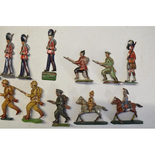 105 - Collection of metal flats and pressed tin figures to include 100mm mounted kettle drummer and trumpe... 