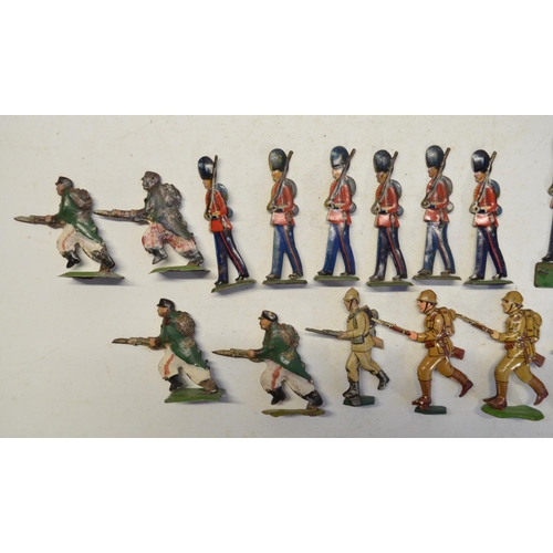 105 - Collection of metal flats and pressed tin figures to include 100mm mounted kettle drummer and trumpe... 