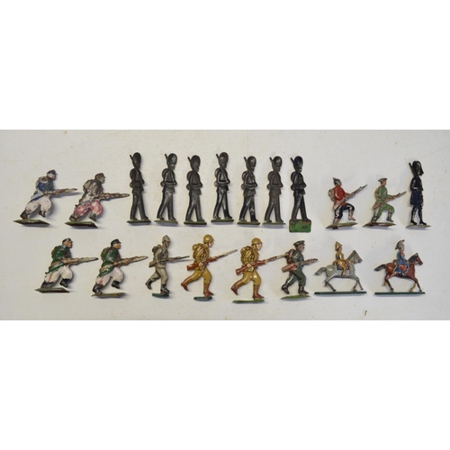 105 - Collection of metal flats and pressed tin figures to include 100mm mounted kettle drummer and trumpe... 