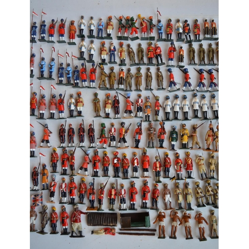 88 - Collection of metal soldier figures, mostly British Indian Army to include W. Britain's, mostly repa... 