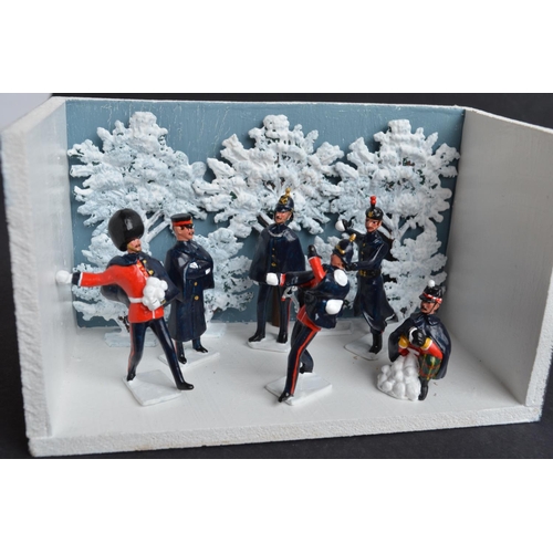 97 - Two charming winter themed dioramas, all figures from Replica to include soldiers having a snowball ... 