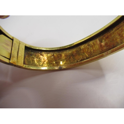 2 - Yellow metal hinged bangle with Etruscan style detail, 13.58g