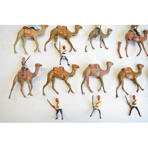 125 - Collection of competently home painted metal camels and camel riders plus 4 standing Arab soldiers o... 