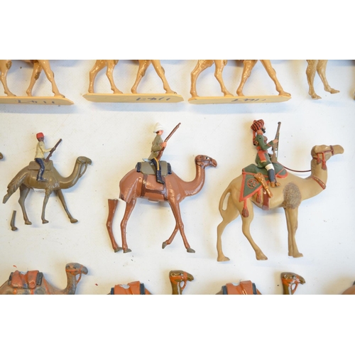 125 - Collection of competently home painted metal camels and camel riders plus 4 standing Arab soldiers o... 