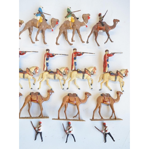 125 - Collection of competently home painted metal camels and camel riders plus 4 standing Arab soldiers o... 