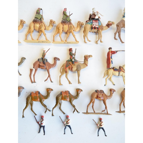 125 - Collection of competently home painted metal camels and camel riders plus 4 standing Arab soldiers o... 