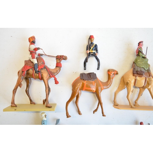 125 - Collection of competently home painted metal camels and camel riders plus 4 standing Arab soldiers o... 