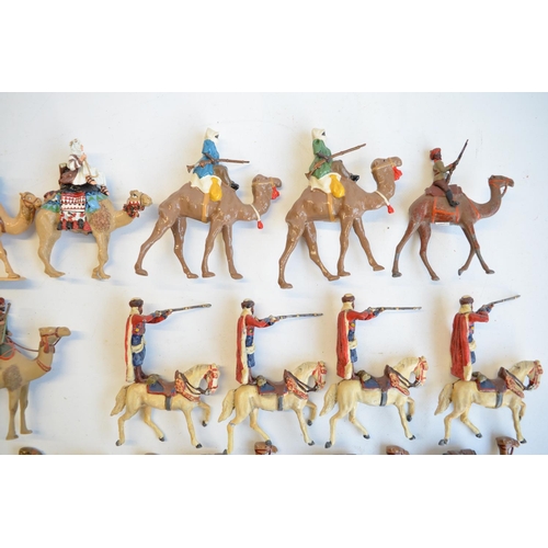 125 - Collection of competently home painted metal camels and camel riders plus 4 standing Arab soldiers o... 