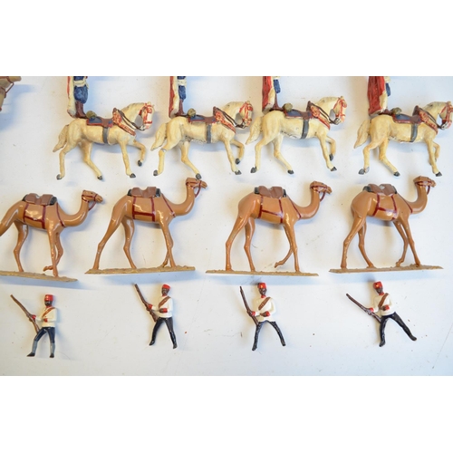 125 - Collection of competently home painted metal camels and camel riders plus 4 standing Arab soldiers o... 