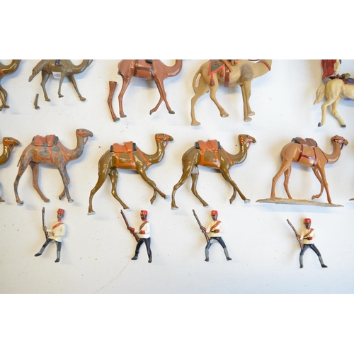 125 - Collection of competently home painted metal camels and camel riders plus 4 standing Arab soldiers o... 