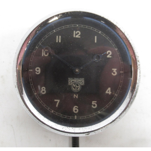 1533 - Smiths 8 day chrome car clock, signed black Arabic dial, no. X38185/748910 and similar Smiths car cl... 