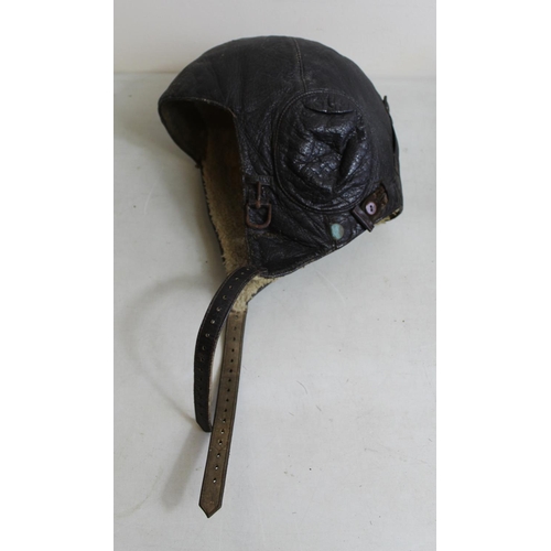 1456 - WWII Siemens LKpW101 Luftwaffe flying helmet with wool lining. Displayed on vintage realistic plasti... 