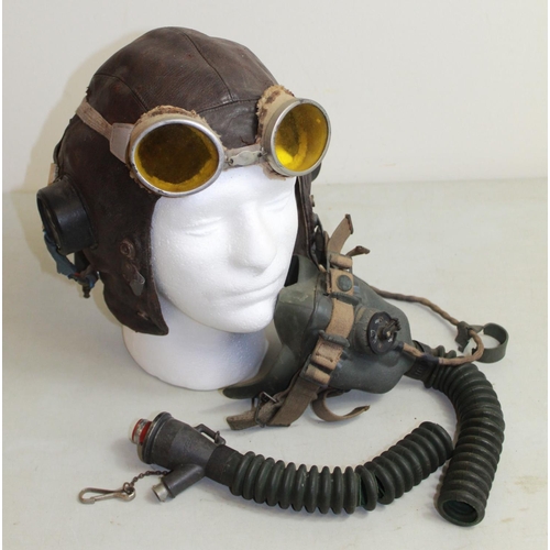 1459 - Unmarked C1940s leather flying helmet with British military-issue oxygen mask and flying goggles