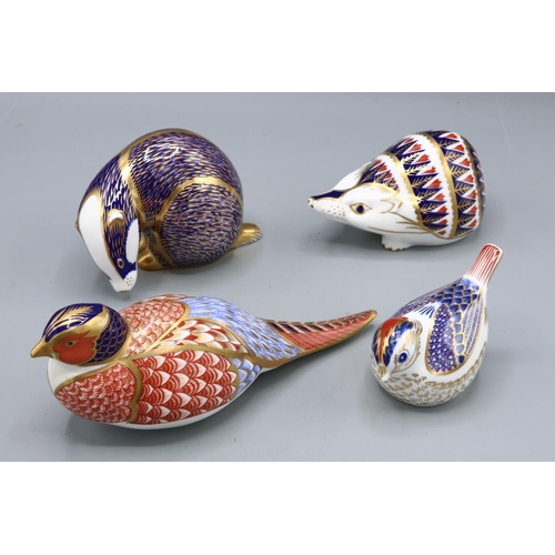 320 - Royal Crown Derby Imari paperweights, Badger, Goldcrest, Hedgehog, and Pheasant, pheasant lacking st... 