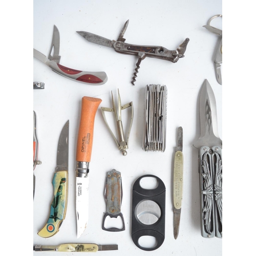 1299 - Collection of pocket knives, multi-tools, cigar cutter, bottle opener, a sharpening stone etc. (22)