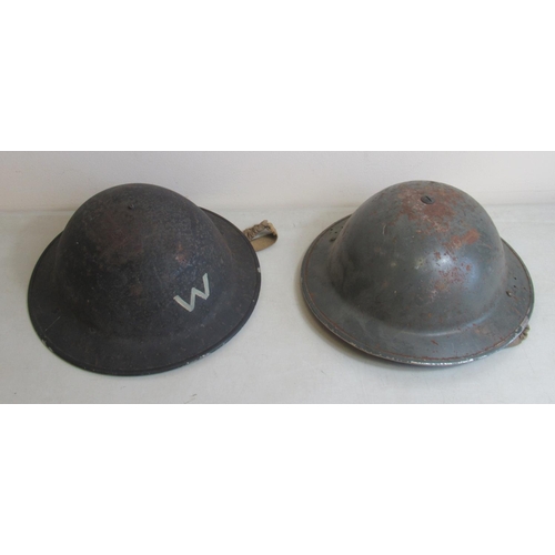 1443 - Two c1940s British steel helmets, one for an Air Raid Warden and one unmarked. Also with a British M... 