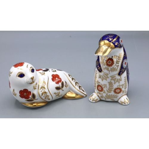 319 - Royal Crown Derby Imari paperweights, Seal and Platypus, both with gold paperweights, max. H11.5cm (... 