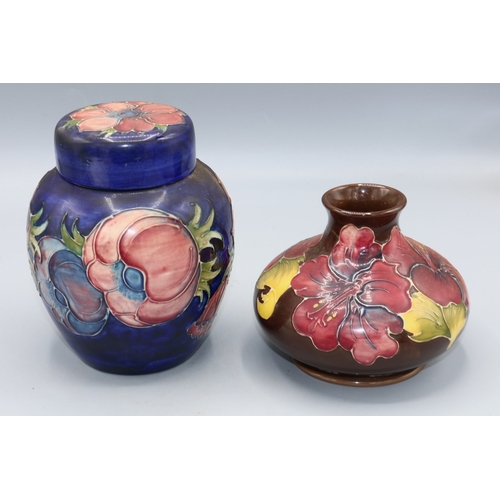 336 - Moorcroft Pottery, Clematis pattern ginger jar, purple and blue flowers on dark blue ground, H16cm, ... 