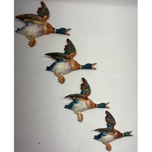 315 - Four Beswick wall hanging ducks, models 596-1/2/3/4, A/F, and a Murano style coloured glass hunting ... 