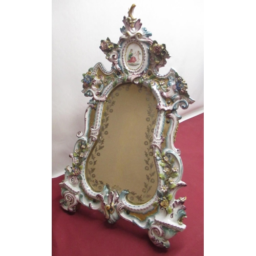 1141 - Late C19th porcelain framed easel mirror, the cartouche plate with etched border of flowers in an el... 