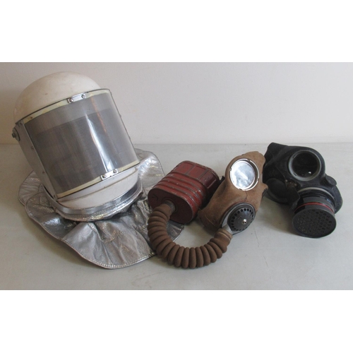 1441 - RAF Mk 3 firefighter helmet and two 20th century gas masks. (3)