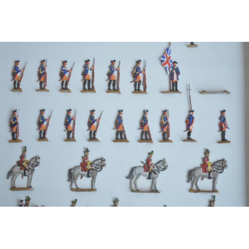 74 - Collection of thirteen framed hand painted alloy flat mostly soldier figures/figure sets to include ... 