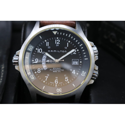 213 - Hamilton Khaki Field stainless steel automatic wristwatch with day date and world time function, sig... 