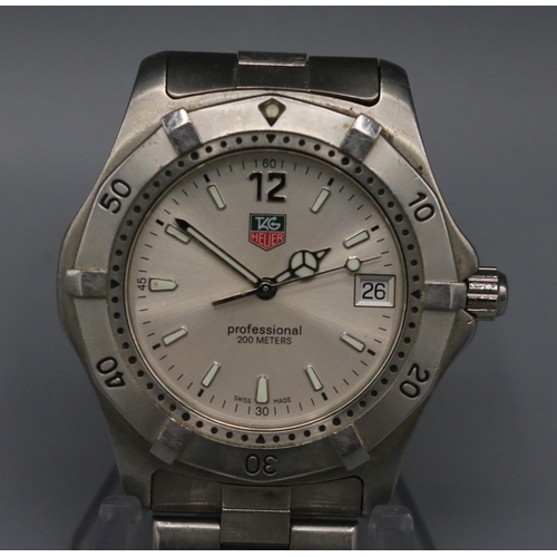 221 - Tag Heuer stainless steel quartz wristwatch with date, signed silvered dial, centre seconds, signed ... 