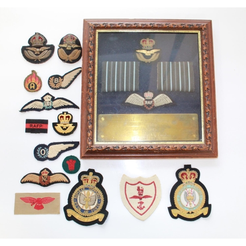 1429 - Collection of RAF cloth badges. Australian Wings, NZ Wings, Observer wing, cap badges etc. Framed se... 