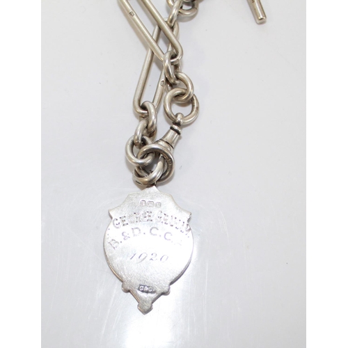 1414 - Silver enamelled award fob, engraved 'George Graham B.&D.C.C.A 1920' on a silver albert chain, silve... 