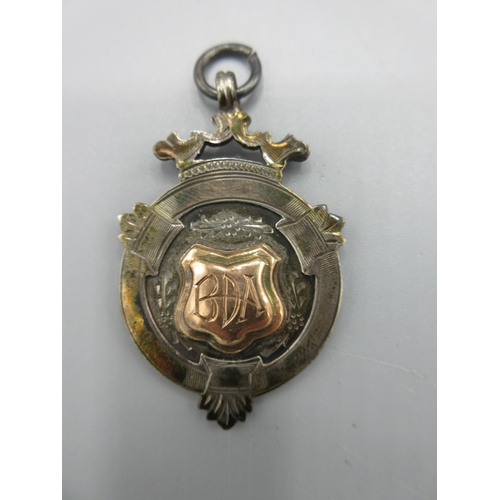 14 - 9ct yellow gold fob with footballer engraving to central panel and engraved initials to back, stampe... 