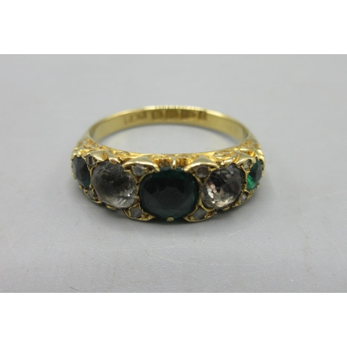 24 - 18ct yellow gold ring set with green and clear stones, stamped 18, 3.5g