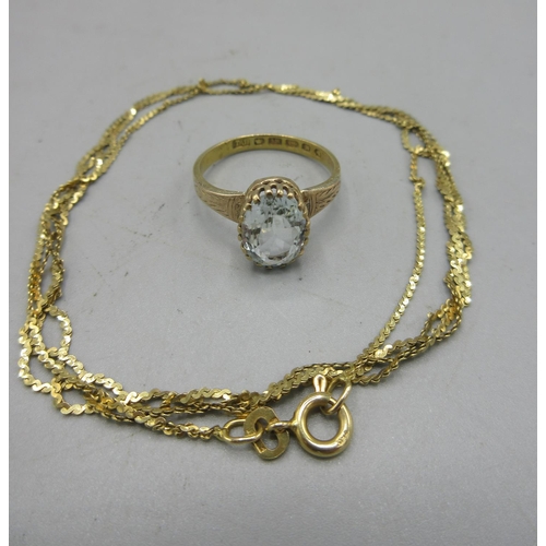 27 - 18ct yellow gold fine twist necklace, stamped 750, and a 18ct gold ring set with pale blue stone, st... 