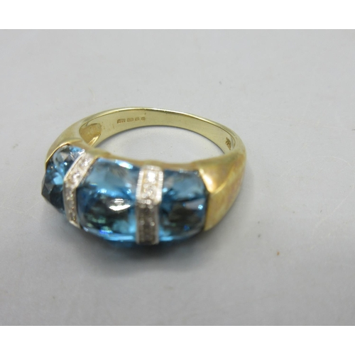 301 - 14ct yellow gold ring set with three blue stones separated by diamond set borders, stamped 585, size... 