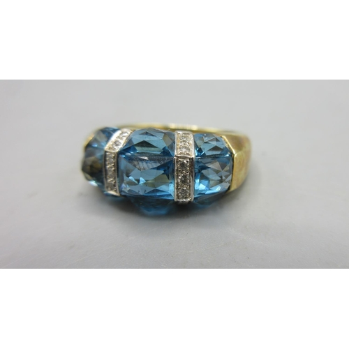 301 - 14ct yellow gold ring set with three blue stones separated by diamond set borders, stamped 585, size... 