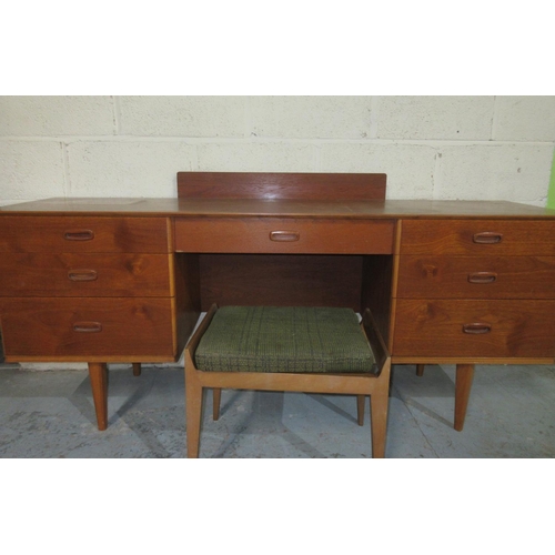 1204 - Mid-Century Austinsuite teak kneehole dressing table, on tapered supports, W165cm D42cm and a stool ... 