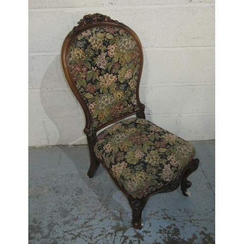 1206 - Victorian carved walnut framed nursing chair, on cabriole legs with ceramic casters, H90cm