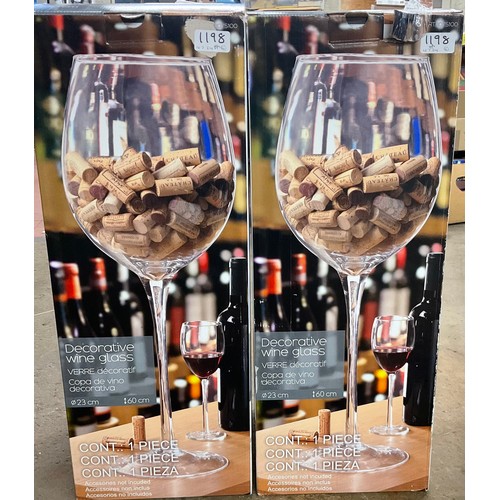 731 - Two large decorative wine glasses H60cm