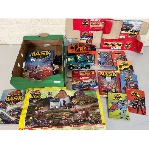 391 - Collection of Kenner Mask vehicles, toy packaging, and books