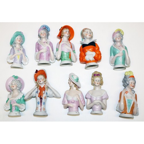 640 - Ten early C20th and later German porcelain pin cushion dolls, most marked 'Foreign', max. H11cm