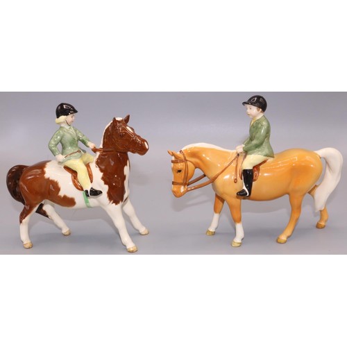 638 - Beswick figures: boy on palomino pony No. 1500, and a girl on a skewbald pony No. 1499 A/F , max. H1... 