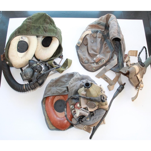 1460 - Three mid-20th century RAF canvas flying helmets, two with original headsets and face masks. A/F. (3... 