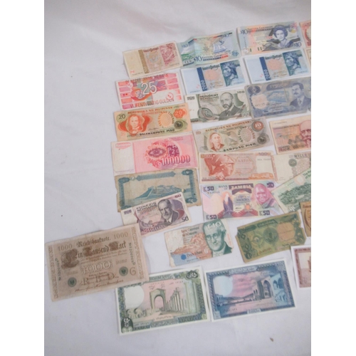 696 - Collection of International banknotes from Afghanistan, Russia, Egypt, Iraq, Portugal, etc.