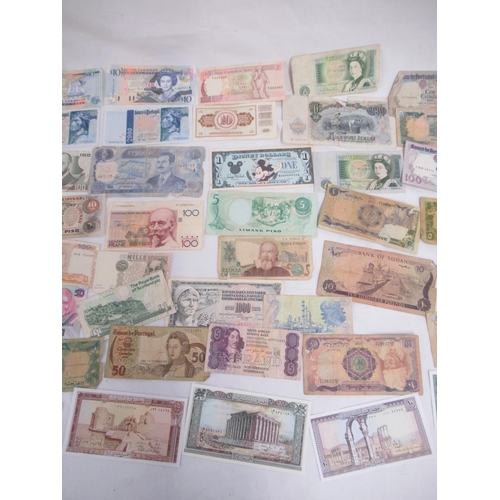 696 - Collection of International banknotes from Afghanistan, Russia, Egypt, Iraq, Portugal, etc.