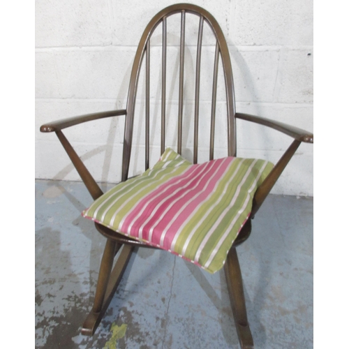 1218 - Dark Ercol hoop and stick back rocking chair, impressed marks