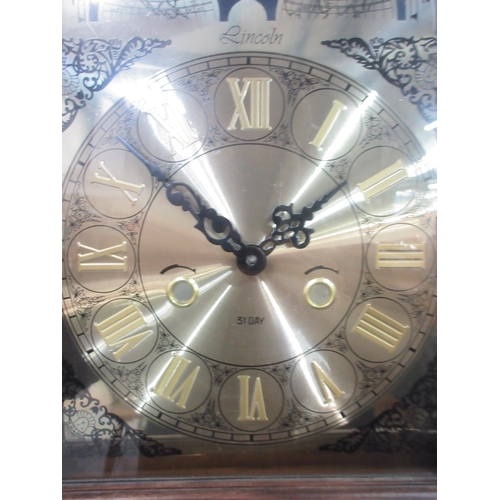 1220 - Mahogany long case clock, brass arched dial with two weights and pendulum, H187cm