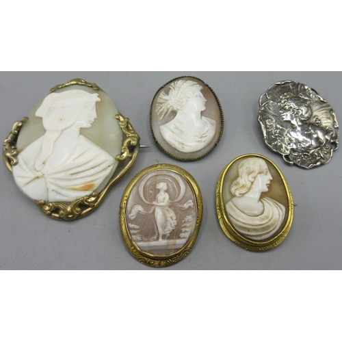 153 - Four cameo brooches set in unmarked yellow metal and an unmarked white metal brooch of similar style... 